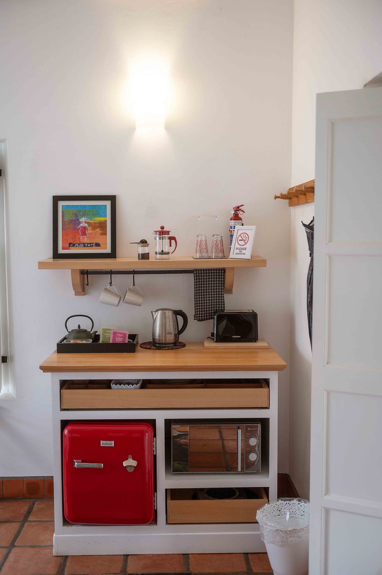 Tea and coffee station with retro red bar fridge