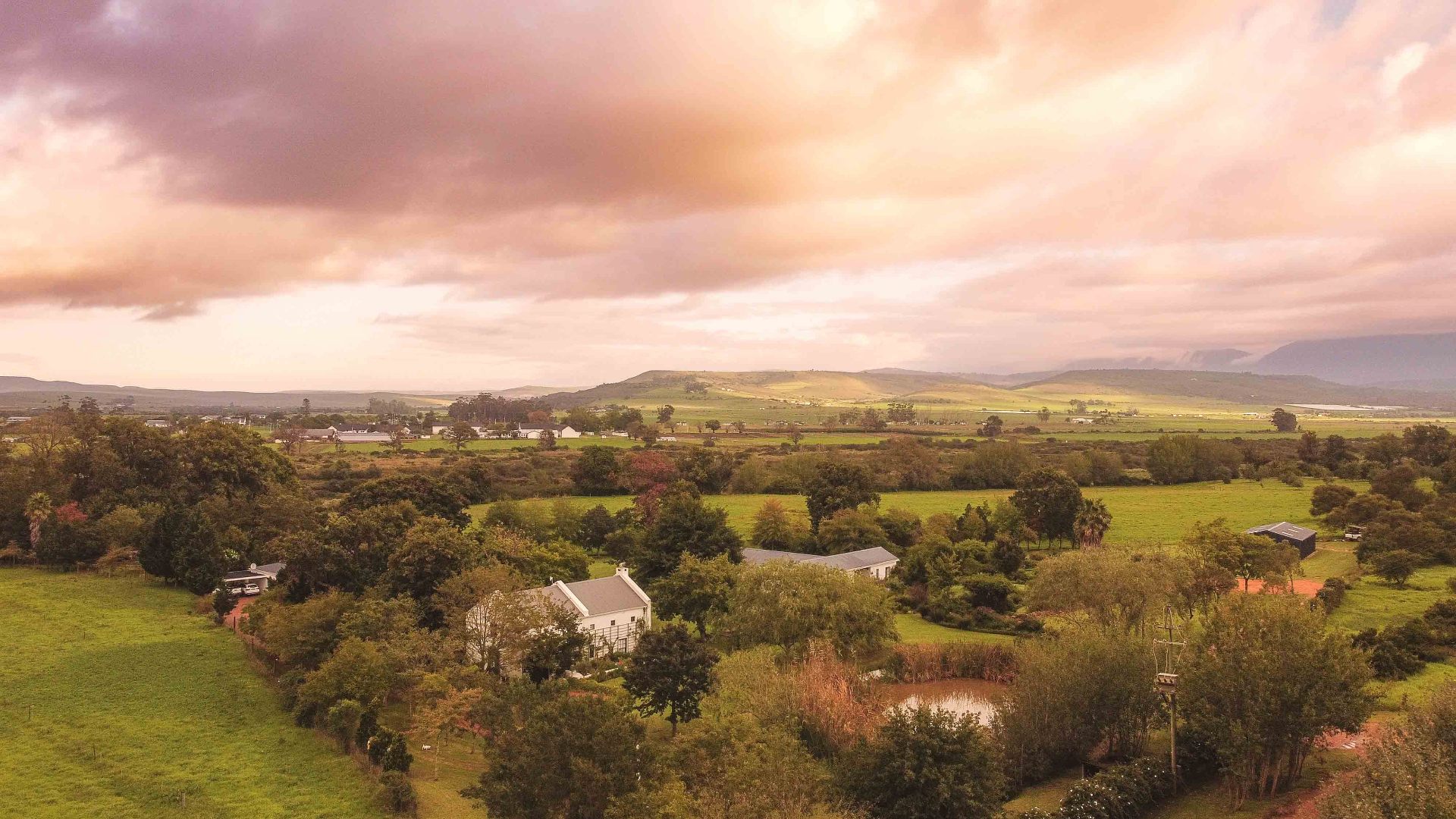 Sunset over Riversdale farmland with Oude Eik nestled among trees