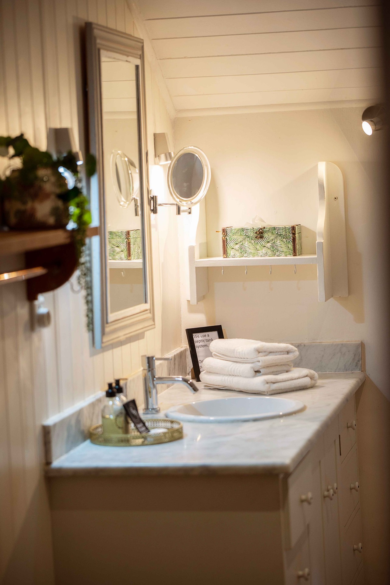 Bright bathroom with marble vanity and mirror